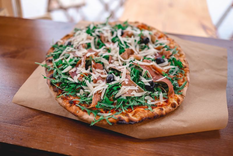 Prosciutto arugula gourmet pizza factory